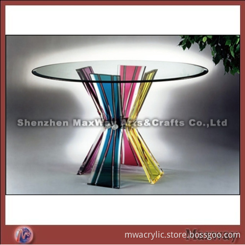 Transparent round acrylic/perspex table with bunchy legs